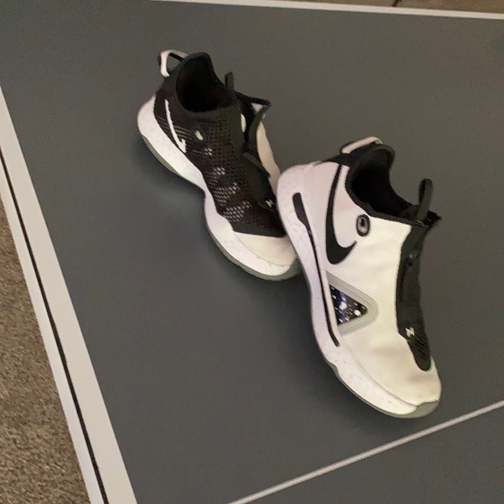 Paul George whir and black zip ups